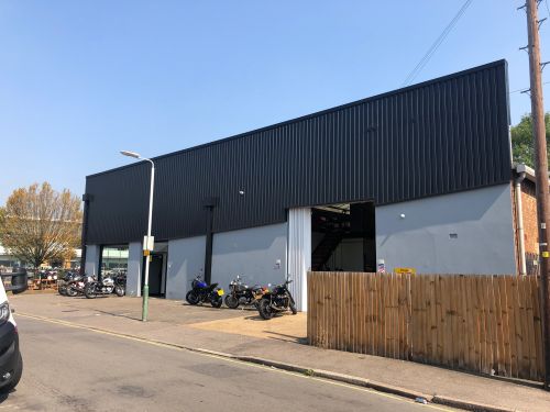 Click Here To Enlarge This Photo Of REFURBISHMENT Overclad existing Masonry Walls with 0&period;7mm Thick Pre Coated Black Prisma&comma; Ral 9005 Galvanised Steel Profile Vertical Cladding